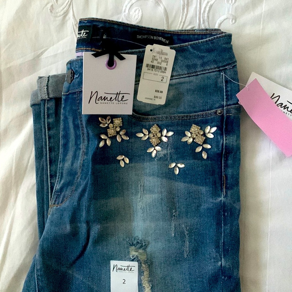 Jeans with embellishments, size 2. Stretchy material.